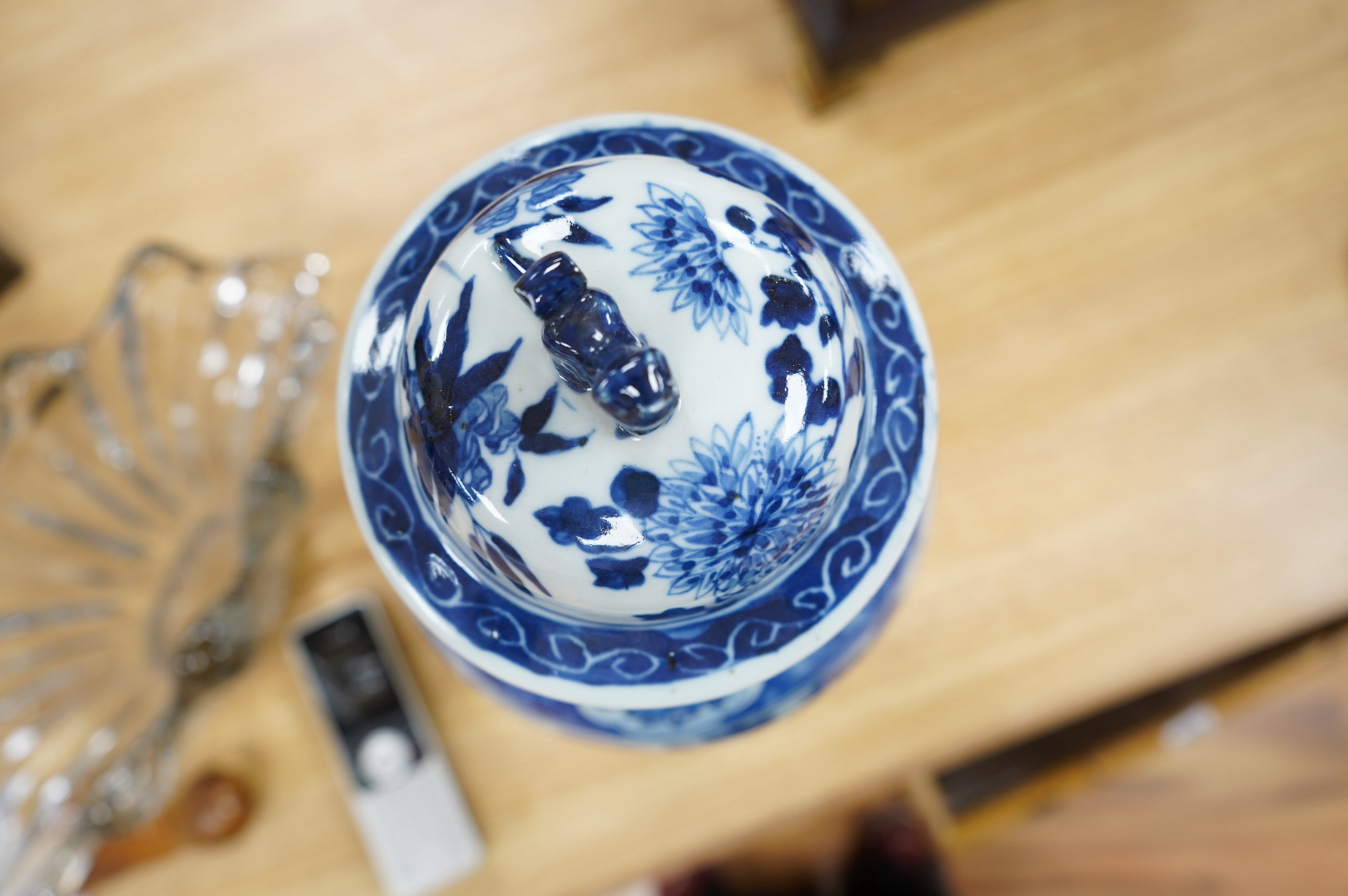 An early 20th century Chinese blue and white dragon vase and cover, 42cm high. Condition - crack and chip from rim of vase down the neck